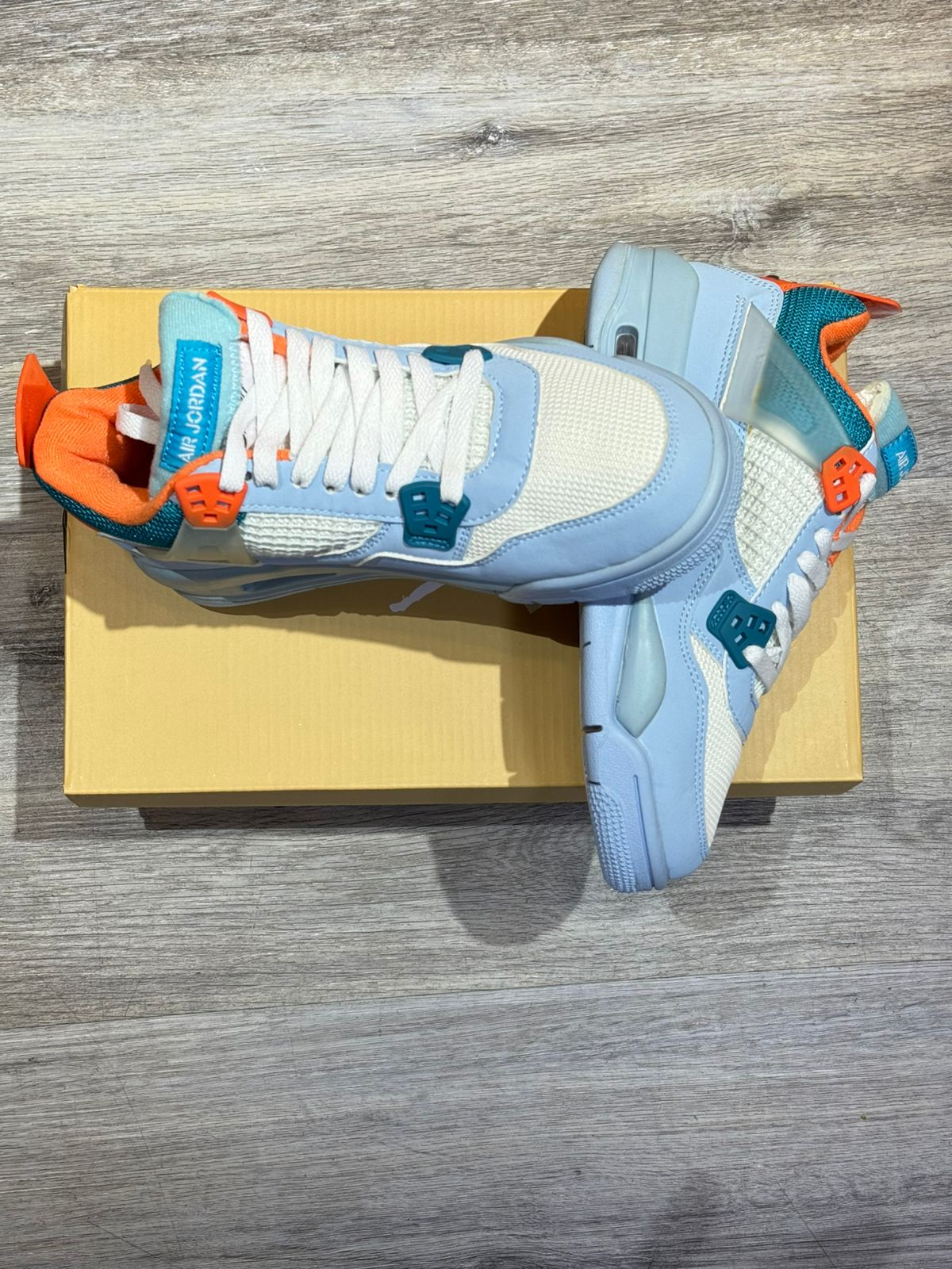 Air Jordan 4 Azul Claro Naranja